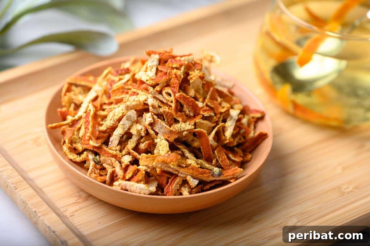 Beyond the Bin: 20 Brilliant Ways to Repurpose Fruit and Vegetable Peels 20 A bowl of dry orange peels.