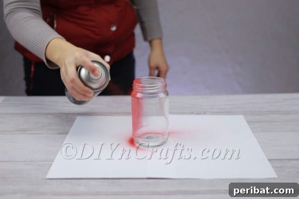 Spark Romance: Create Your Own Valentine Heart Lantern 9 Jar fully covered with red spray paint