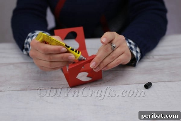 Applying glue to the tab for assembly