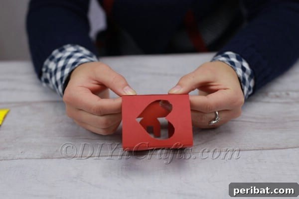 Folding and gluing paper to form a cube