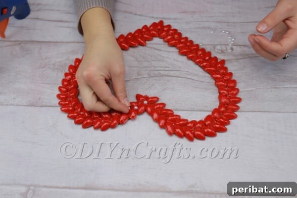 Adding faux pearls to the heart