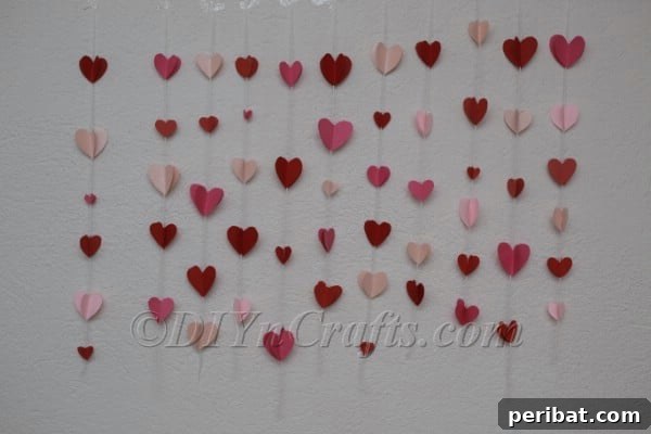 Paper heart garland styled as festive wall decor