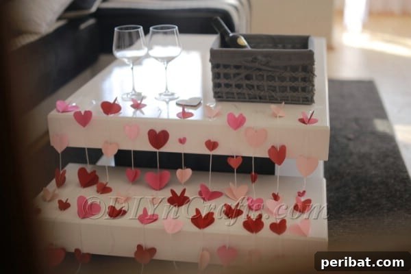 Paper hearts hanging from the ceiling for a whimsical effect