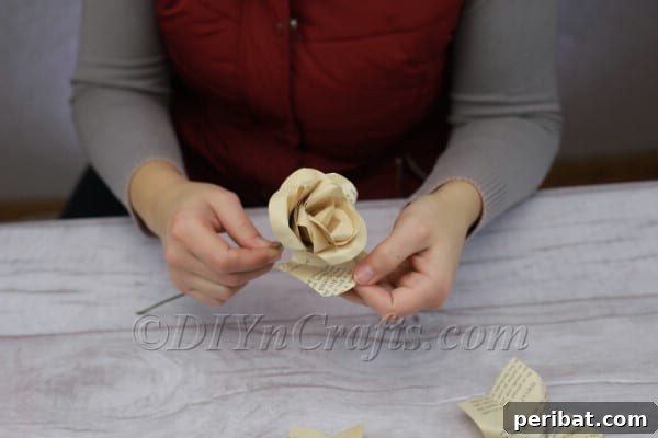 Close-up of progressively larger petals being added to a paper rose