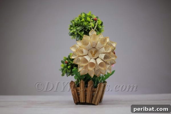 Finished flower in a container with greenery.