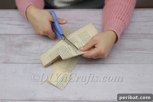 Cutting book pages into squares.
