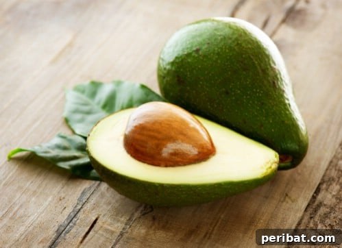 Turn Scraps Into Staples Your Guide To Regrowing Food 6 Avocado seed sprouting with toothpicks in water