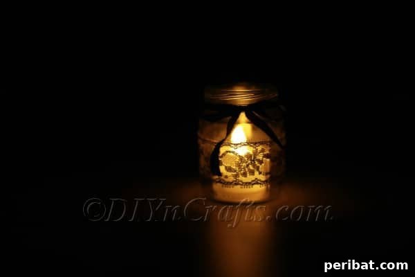 Craft a Charming Lace Lantern Effortlessly 10 Lace jar lantern glowing beautifully in a dimly lit setting, creating a warm ambiance
