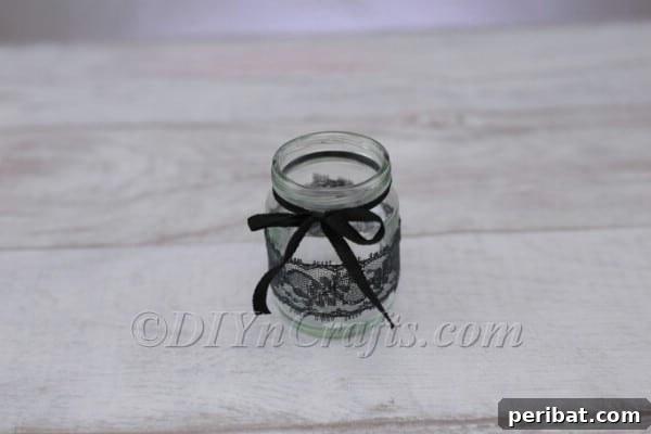 Craft a Charming Lace Lantern Effortlessly 8 Close-up of a perfectly tied ribbon bow on the jar lantern, adding a charming detail