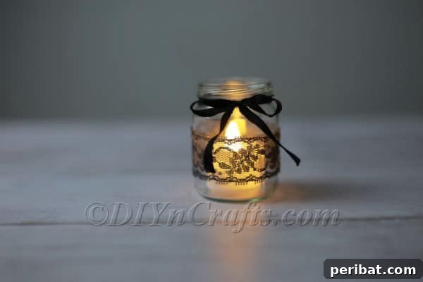Craft a Charming Lace Lantern Effortlessly 9 Placing an LED tea light inside a finished lace jar lantern to illuminate it