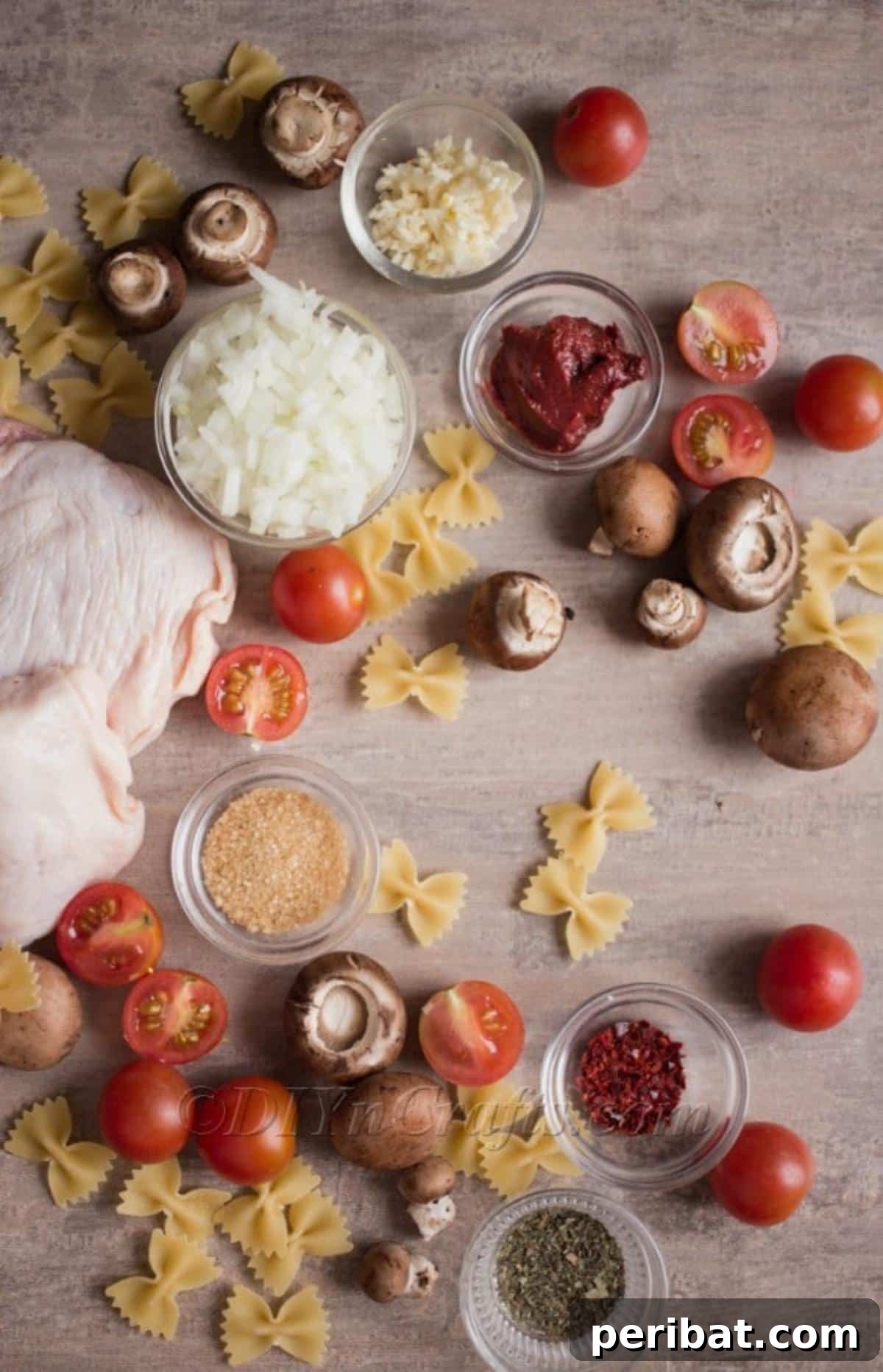 Fresh ingredients laid out for chicken pasta.