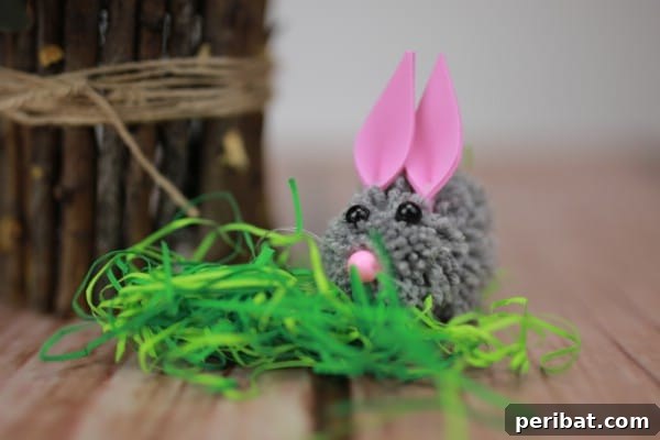 Close-up of a finished DIY pom-pom Easter bunny