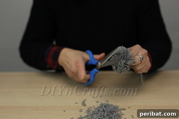 Further trimming to refine the pom-pom's shape
