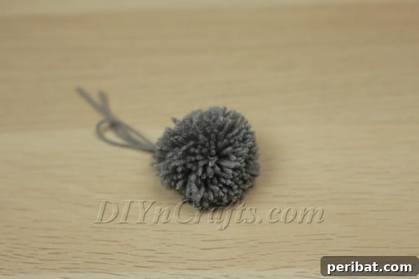 Final touches on shaping the pom-pom