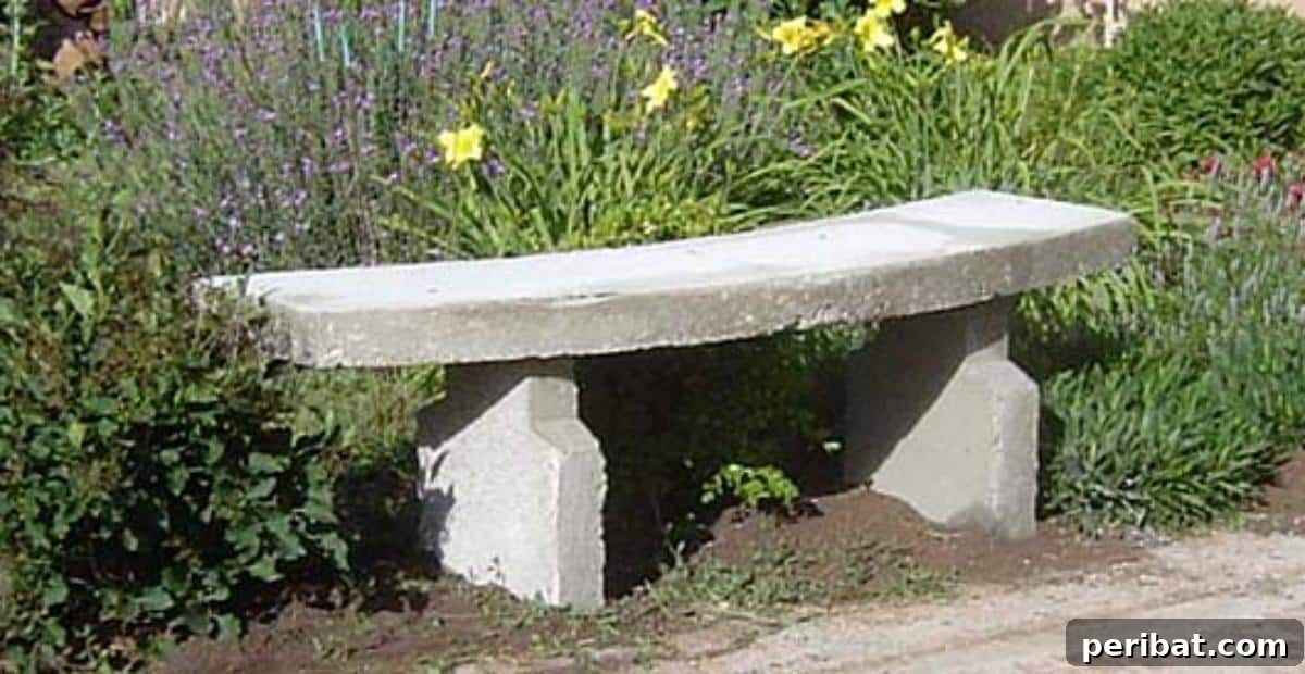 DIY Outdoor Oasis: 10 Projects for Beauty and Bliss 7 A rustic yet elegant DIY concrete garden bench placed amidst lush greenery.