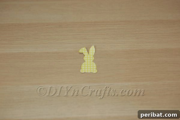DIY Cute Paper Easter Bunny Garland with Free Printable Template 6 Cutting intricate bunny shapes