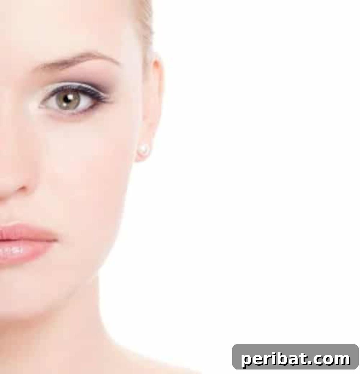 Woman gently applying castor oil around her eyes for soothing effect