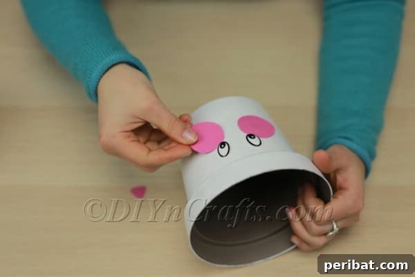 Attaching the pink nose to the planter