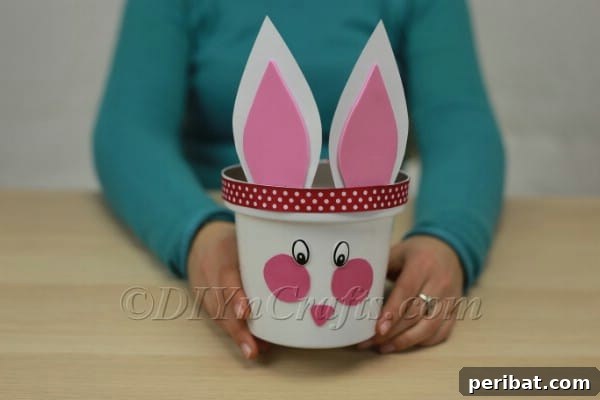 Decorating the planter with a decorative ribbon