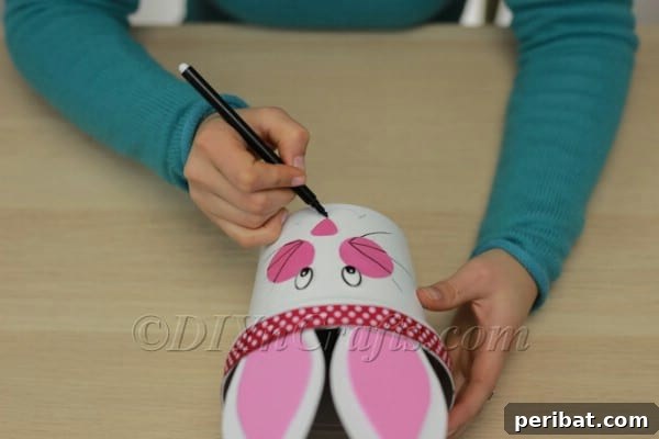 Drawing whiskers on the bunny's cheeks