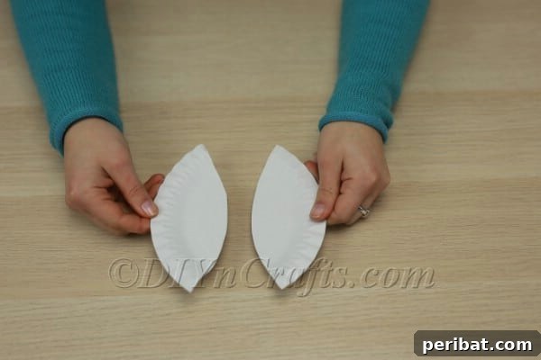 Two paper plate bunny ears ready to be attached
