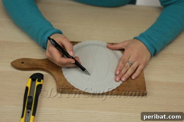 Three Adorable Easter Bunny Crafts Using Paper Plates 5 Positioning bunny ears on a paper plate for cutting