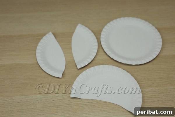 Three Adorable Easter Bunny Crafts Using Paper Plates 27 Cutting a section from a paper plate for the basket pouch