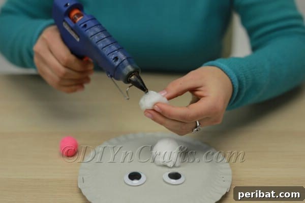 Three Adorable Easter Bunny Crafts Using Paper Plates 33 Gluing cotton stuffing for fluffy bunny cheeks