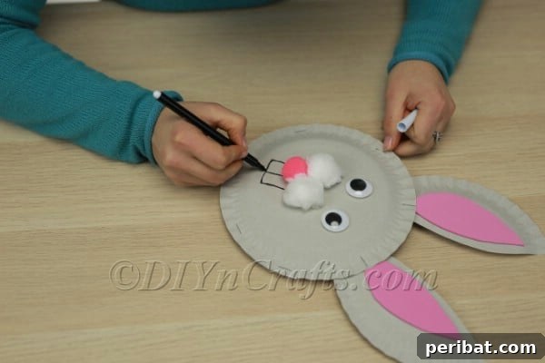 Three Adorable Easter Bunny Crafts Using Paper Plates 35 Drawing bunny teeth with a black marker