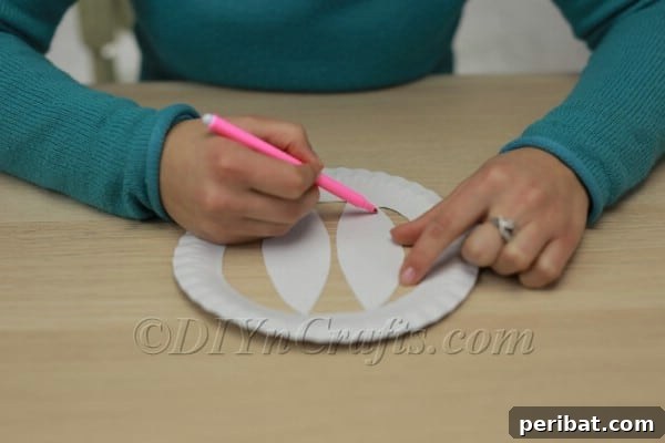 Three Adorable Easter Bunny Crafts Using Paper Plates 9 Paper plate with bunny ears cut out and attached to rim