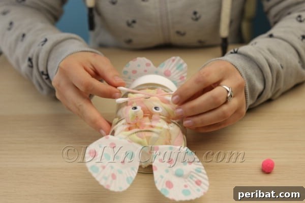 Craft an Adorable Easter Bunny Treat Holder from an Empty Nutella Container 14 Adding Q-tip whiskers to the bunny face