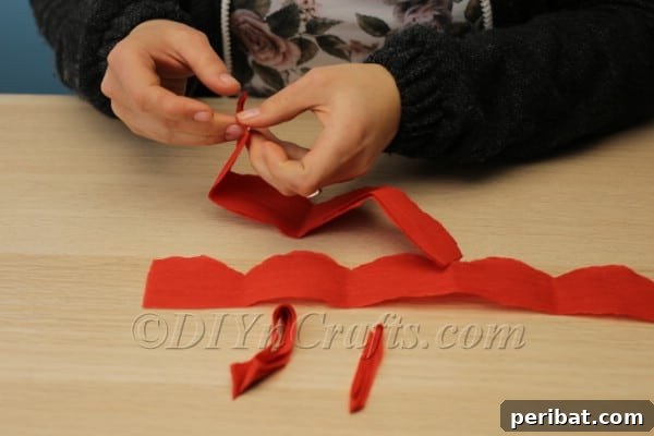 Blossoming Beauty: Craft Your Own Single Egg Easter Basket 11 Step 6: Close-up of the prepared petal strip of tissue paper.