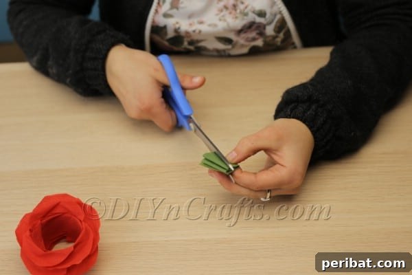 Blossoming Beauty: Craft Your Own Single Egg Easter Basket 19 Step 11: Preparing a strip of green tissue paper for the sepals.