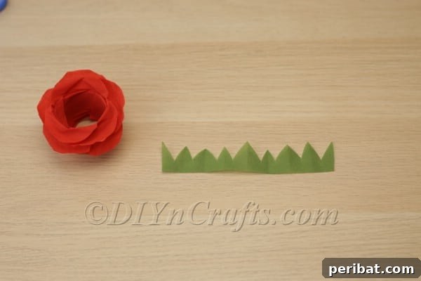 Blossoming Beauty: Craft Your Own Single Egg Easter Basket 20 Step 11: Cutting a zigzag pattern along the green tissue paper for sepals.