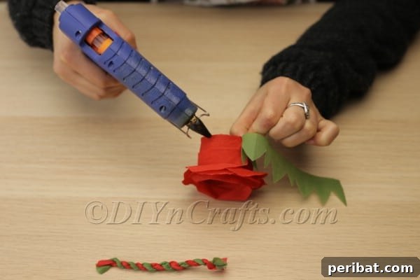 Blossoming Beauty: Craft Your Own Single Egg Easter Basket 21 Step 12: Attaching the green sepals around the base of the flower basket.
