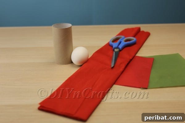 Step 1: Measuring and cutting the toilet paper tube to 4 cm height.
