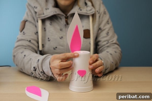 Craft Your Own Adorable Easter Bunny Cups 11 Attaching bunny ears to the back of the cup