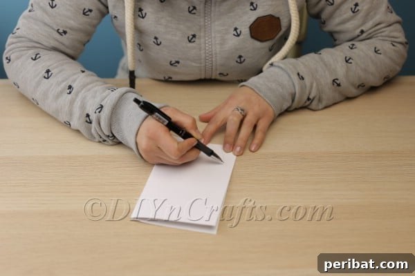 Drawing bunny ear outline on folded paper