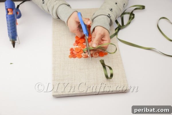 Whimsical Button Carrot Wall Art for Easter 12 Creating ribbon loops for carrot top.
