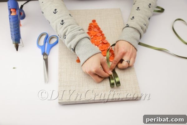 Attaching ribbon loops with hot glue.