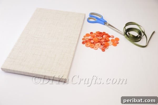 Sketching a carrot outline on canvas.