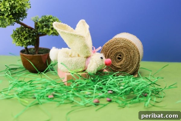 An adorable DIY Easter bunny crafted from a simple dish towel, perfect for spring decoration or a handmade gift.