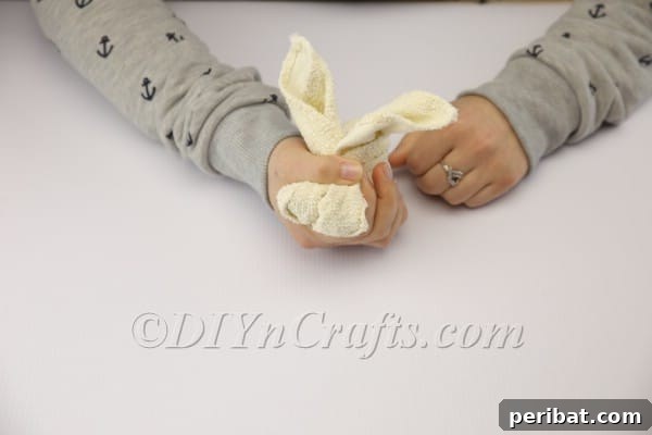 Sweet Towel Bunnies: An Easy Easter DIY 7 Adjusting the bunny's ears and head for perfect symmetry.