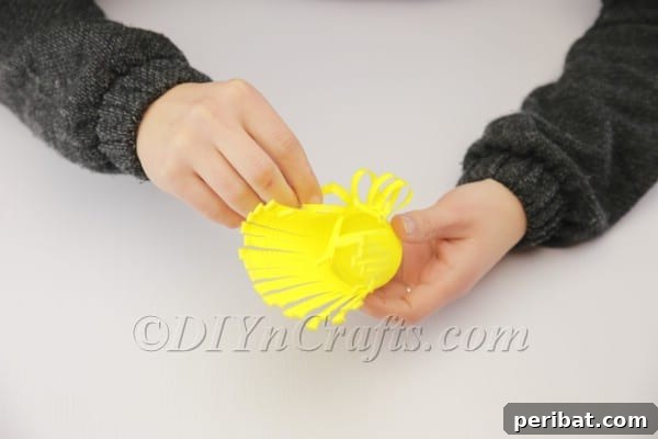 Transform a Plastic Cup into an Adorable Easter Basket 7 Interlocking plastic cup fringes to form loops