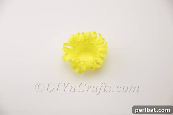 Side view of the looped plastic cup basket