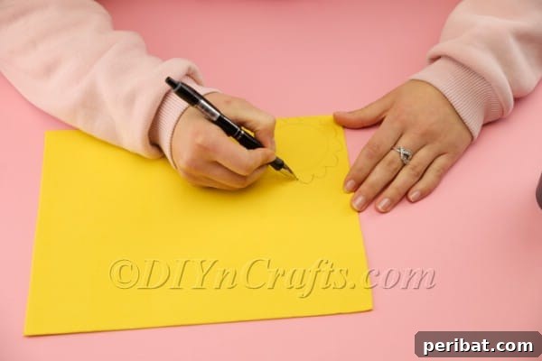 Tracing the basket bottom onto a yellow foam sheet