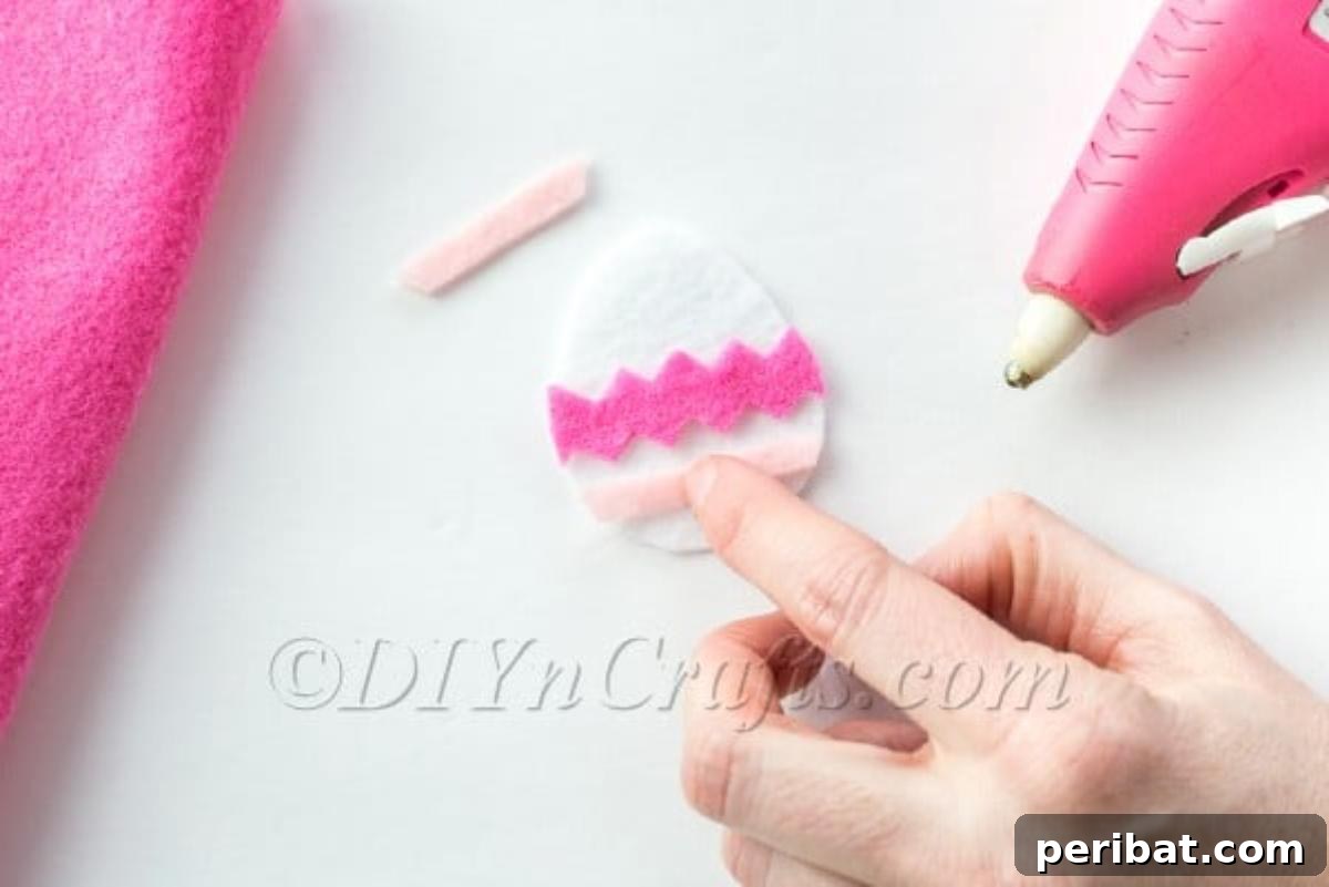 Make a No Sew Easter Basket Free Template Video Tutorial 8 Gluing together the decor egg pieces.