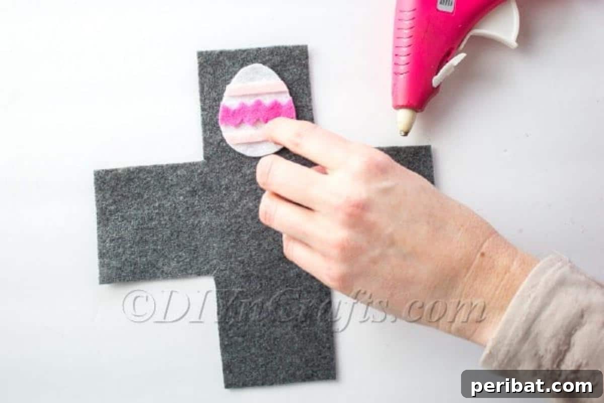 Make a No Sew Easter Basket Free Template Video Tutorial 9 Gluing the finished egg decoration to the un-assembled basket.