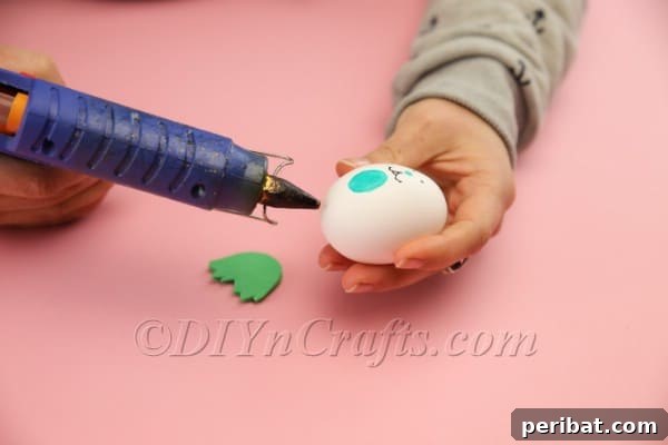 Hoppy Easter Egg Bunny Craft 13 Attaching bunny feet to the bottom of the egg
