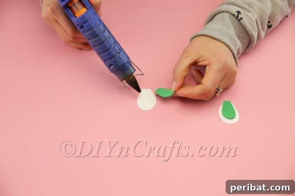 Hoppy Easter Egg Bunny Craft 19 Gluing green inner ears onto white outer ears
